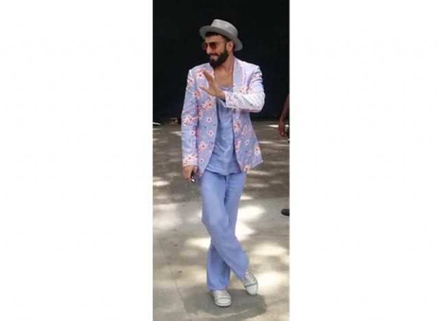 Pics: Ranveer Singh in pinstriped suit, double ponytail proves he is the  king of quirk