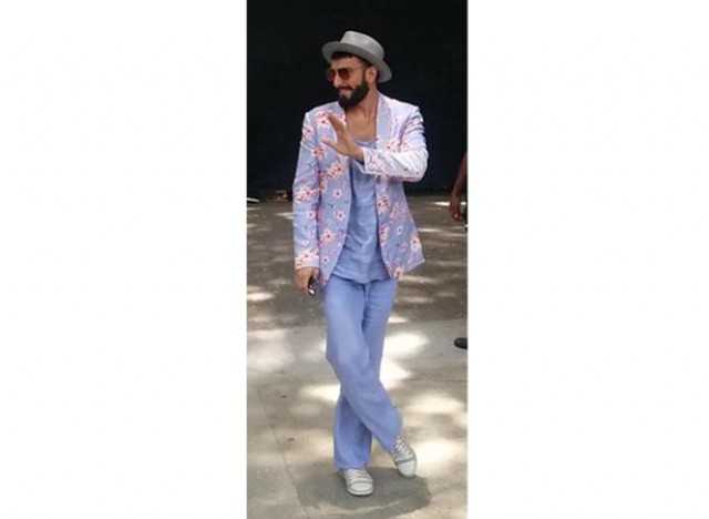 Pics: Ranveer Singh in pinstriped suit, double ponytail proves he is the  king of quirk