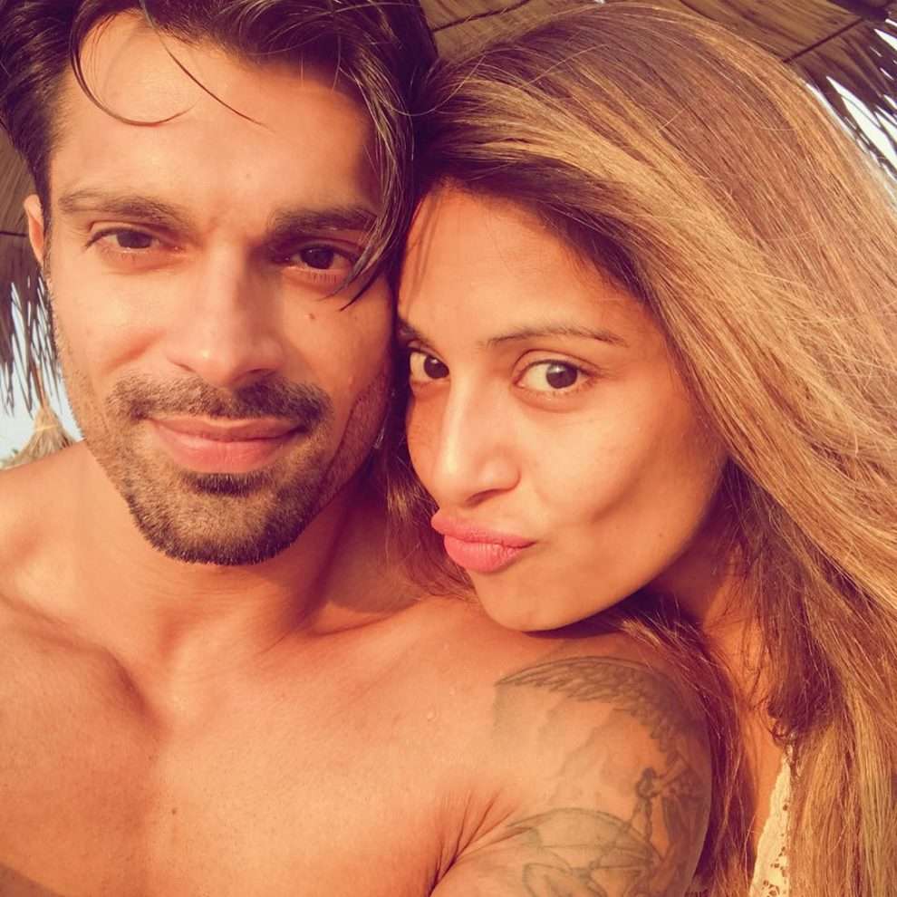 Bipasha gets emotional & gives hubby Karan a tight hug as he sees her off