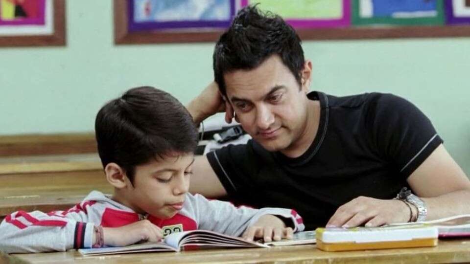 Aamir Khan as Ram Shankar Nikumbh in Taare Zameen Par  Aamir Khan stepped up as a director for the first time in Taare Zameen Par. He did not only direct but also played the central part in the film that was about a young boy suffering from Dyslexia and how Aamir being his teacher helped him through. The film showed the importance of a helpful teacher who understands his students rather than imposing one’s views on them. TZP was a huge hit and struck a chord with the masses instantly.