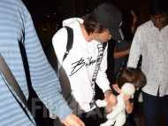 Photos: Shah Rukh Khan returns from London with son AbRam Khan
