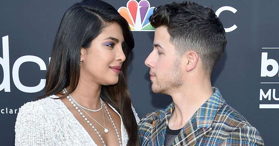 Nick Jonas plants a kiss on Priyanka Chopra at the Billboard Music ...