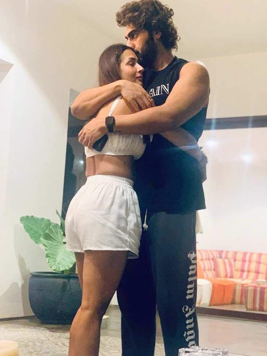 Malaika Arora cuddling Arjun Kapoor.