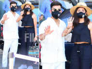 Virat Kohli and Anushka Sharma pose for the cameras as they return from their Maldives trip