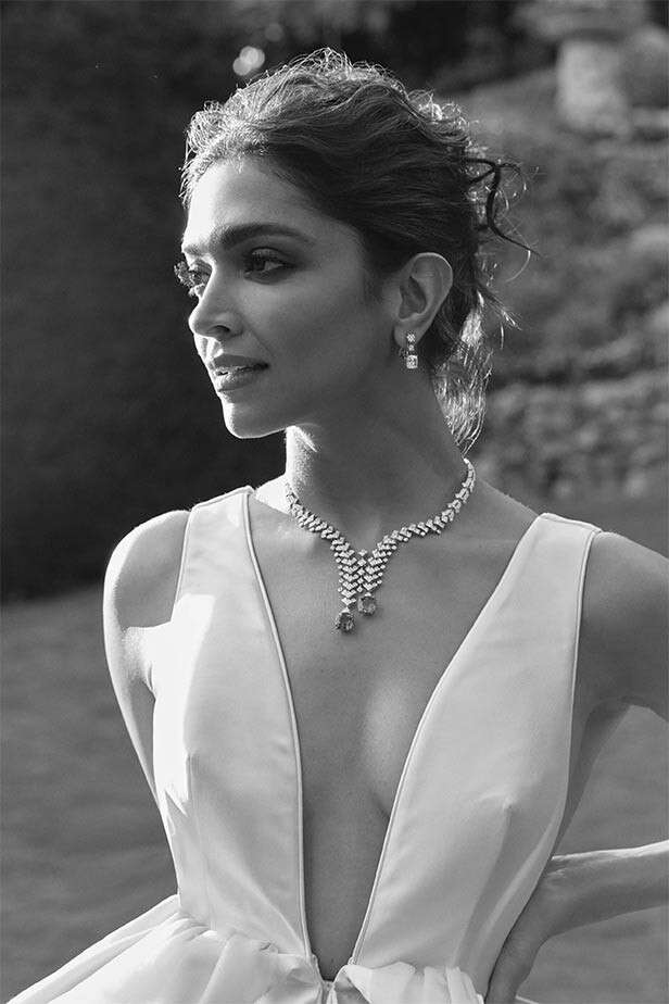 Deepika Padukone in white outfit.