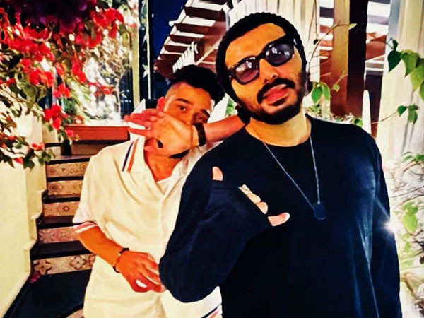 AP Dhillon poses for a picture with Arjun Kapoor