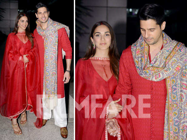 Newlyweds Kiara Advani and Sidharth Malhotra, twin in red, hold hands as they arrive in Delhi. Pics