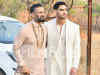 Suniel Shetty and Ahan Shetty greet the paparazzi at Athiya Shetty and KL Rahul's wedding venue