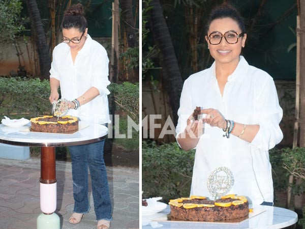 Rani Mukerji cuts a cake at her pre-birthday celebrations with the paparazzi