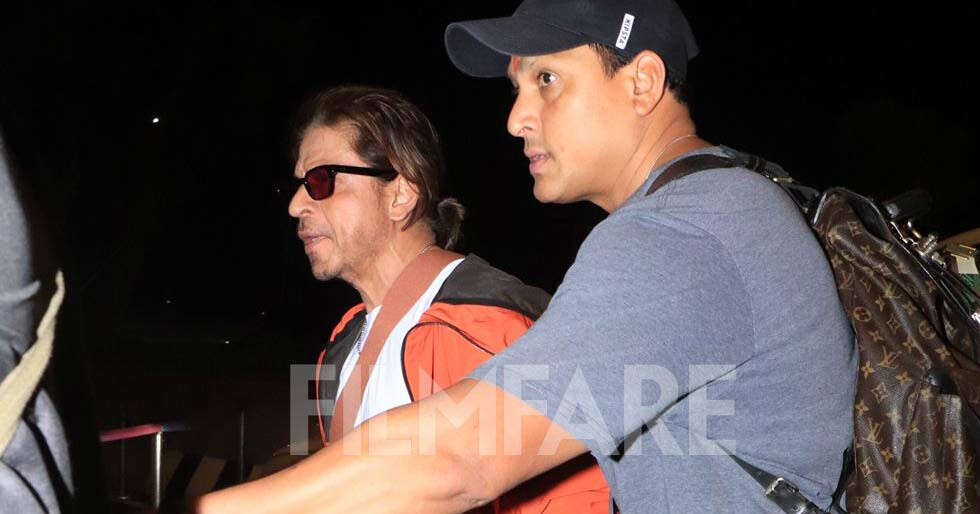 PHOTOS: Shah Rukh Khan looks uber cool in a white and orange ensemble