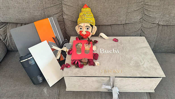 Ram Charan & Upasana Gift Hanuman Chalisa And Cheriyal Mask To Peddi Director