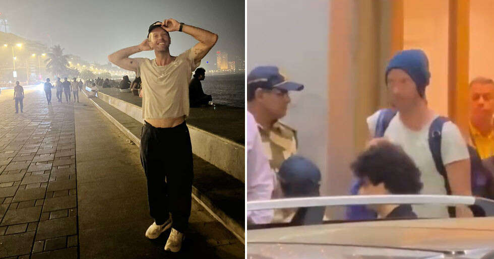 Chris Martin looks content while taking photos at Marine Drive