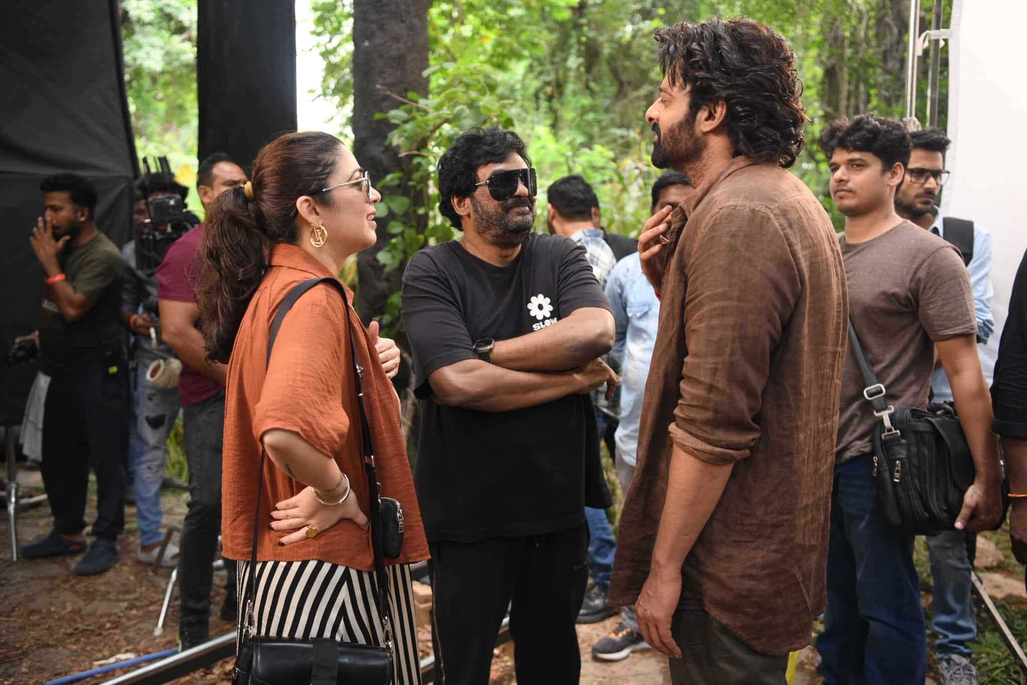 Puri Jagannadh and Charmme with Prabhas on the sets of The Raja Saab