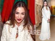 Malaika Arora Khan looks stunning in a sweeping-length white dress and dark lips
