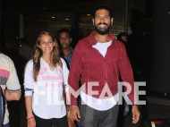 Newlyweds Yuvraj SIngh and Hazel Keech snapped at the airport post their honeymoon
