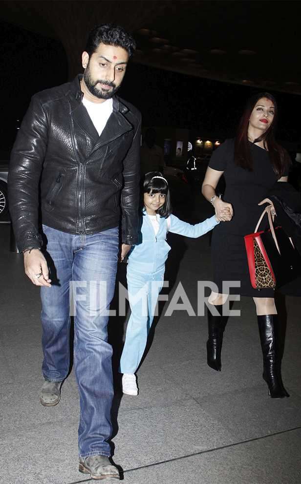 Aishwarya Rai with Abhishek Bachchan and Aaradhya switches up airport  fashion with her elegant all-black attire. Watch
