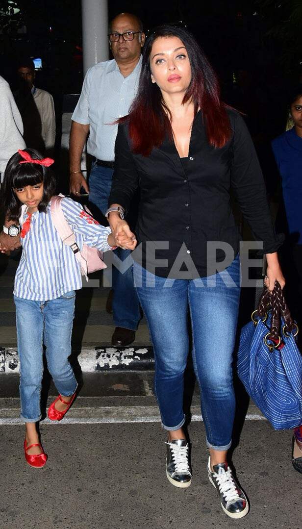 Aishwarya Rai with Abhishek Bachchan and Aaradhya switches up airport  fashion with her elegant all-black attire. Watch