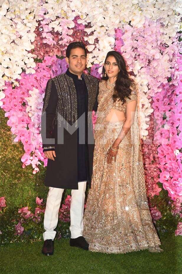 Newlyweds Akash Ambani and Shloka Ambani arrive at their reception ...