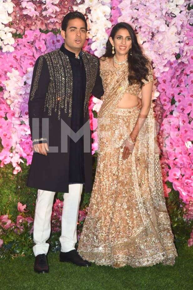 Newlyweds Akash Ambani and Shloka Ambani arrive at their reception ...