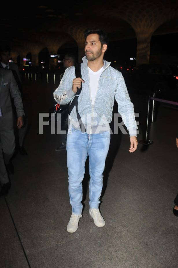 Varun Dhawan ups casual look in white T-shirt and jeans with Rs 65k quirky  orange jacket - India Today