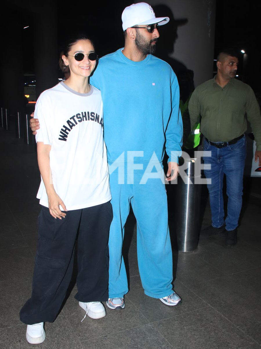 Ranbir Kapoor keeps Alia Bhatt close as they get clicked at the airport ...