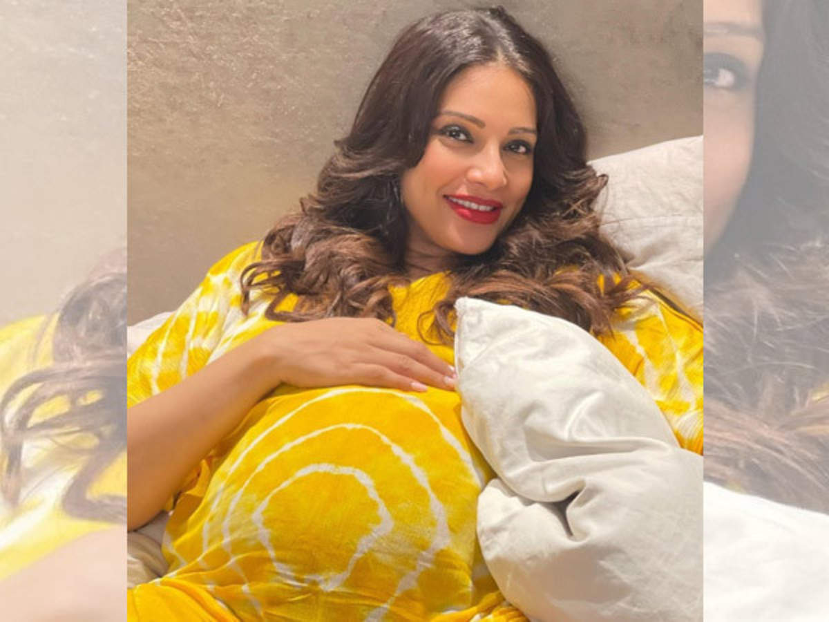 Mom-to-be Bipasha Basu flaunts her baby bump, looks beautiful in a yellow  dress. 